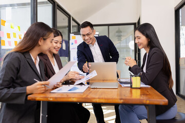 Group of Asian business working plan analysis project brainstorm in modern office, Asian businesspeople team working together, Business startup and company strategy planning concept.

