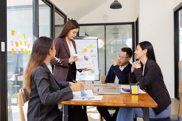Group of Asian business working plan analysis project brainstorm in modern office, Asian...