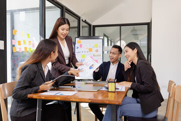Group of Asian business working plan analysis project brainstorm in modern office, Asian...