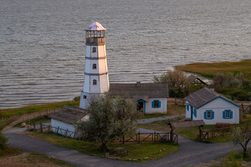Old lighthouse on the shore of the Azov sea on a May evening. Rostov region, Russia
