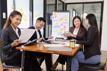Group of Asian business working plan analysis project brainstorm in modern office, Asian...