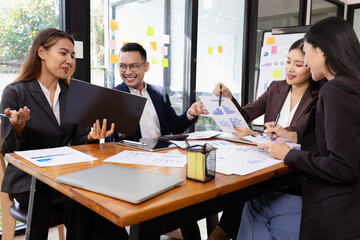 Group of Asian business working plan analysis project brainstorm in modern office, Asian businesspeople team working together, Business startup and company strategy planning concept.
