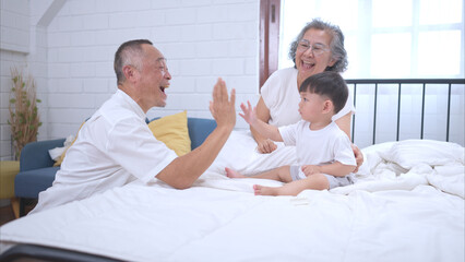 Before putting the kids to bed, grandparents, and kid unwind and play in the bedroom