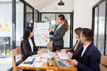 Group of Asian business working with analysis project brainstorm in modern office, Asian...