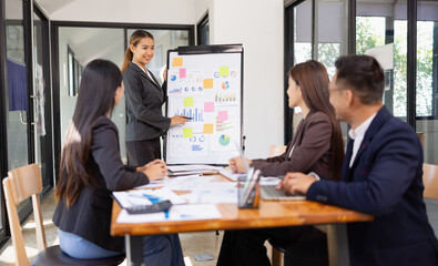 Group of Asian business working with analysis project brainstorm in modern office, Asian...