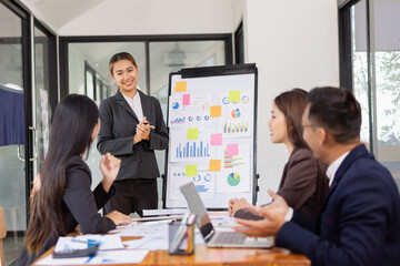 Group of Asian business working with analysis project brainstorm in modern office, Asian...