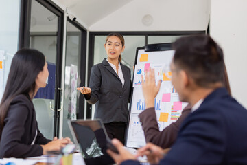 Group of Asian business working with analysis project brainstorm in modern office, Asian...