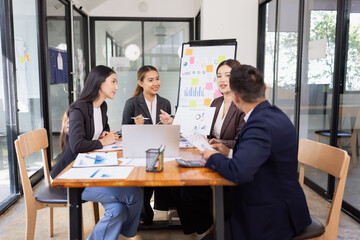 Group of Asian business working with analysis project brainstorm in modern office, Asian...