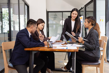 Group of Asian business working with analysis project brainstorm in modern office, Asian...