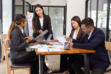 Group of Asian business working with analysis project brainstorm in modern office, Asian...