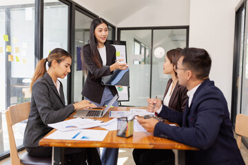 Group of Asian business working with analysis project brainstorm in modern office, Asian...