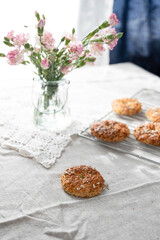 Healthy homemade oat bagels on rustic sunny background. Place for text.