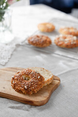 Healthy homemade oat bagels on rustic sunny background. Place for text.