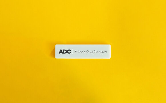 Antibody Drug Conjugate Concept on Yellow Background – Minimalist Pharmaceutical Theme