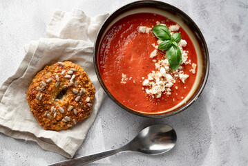 Gazpacho, cold tomato soup on grey table. Minimalistic, place for text