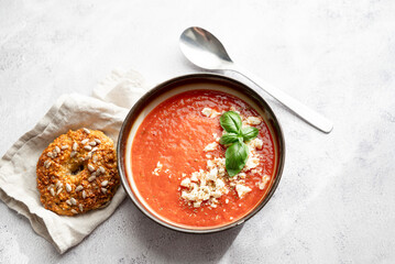 Gazpacho, cold tomato soup on grey table. Minimalistic, place for text