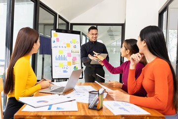Group of Asian business working analysis project brainstorm in modern office, Asian businesspeople...