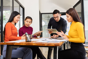 Group of Asian business working analysis project brainstorm in modern office, Asian businesspeople team working together, Business startup and company strategy planning concept.
