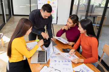 Group of Asian business working analysis project brainstorm in modern office, Asian businesspeople...