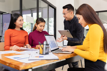 Group of Asian business working analysis project brainstorm in modern office, Asian businesspeople team working together, Business startup and company strategy planning concept.