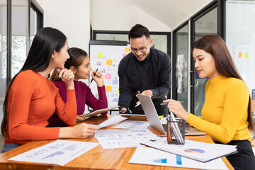 Group of Asian business working analysis project brainstorm in modern office, Asian businesspeople team working together, Business startup and company strategy planning concept.
