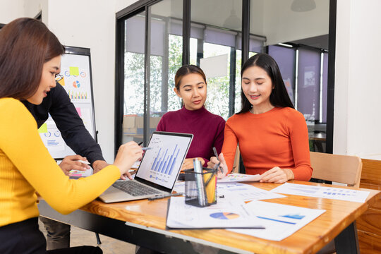 Group of Asian business working analysis project brainstorm in modern office, Asian businesspeople team working together, Business startup and company strategy planning concept.