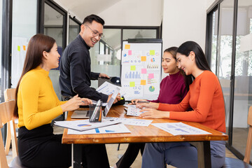 Group of Asian business working analysis project brainstorm in modern office, Asian businesspeople team working together, Business startup and company strategy planning concept.