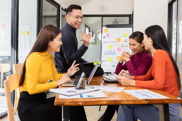 Group of Asian business working analysis project brainstorm in modern office, Asian businesspeople team working together, Business startup and company strategy planning concept.