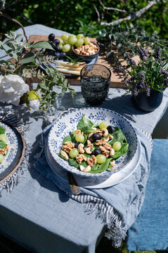 Salad with lamb&acirc;&euro;&trade;s lettuce, grapes, and nuts on table