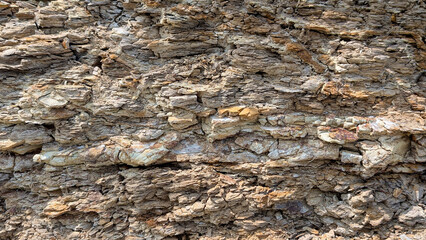 Sedimentary rock layers displaying natural weathering patterns, revealing geological processes...