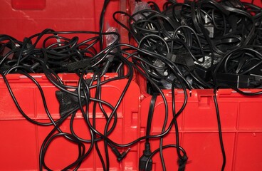Electrical cord storage organizing plastic crate containers unused technology messy space saving.