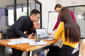 Group of Asian business working analysis project brainstorm in modern office, Asian businesspeople team working together, Business startup and company strategy planning concept.