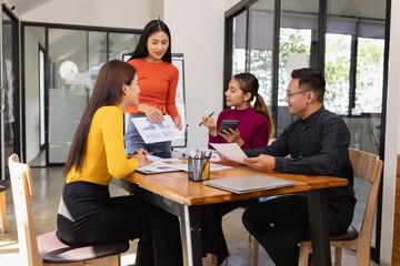 Group of Asian business people working together and presentation a meeting in office, 
