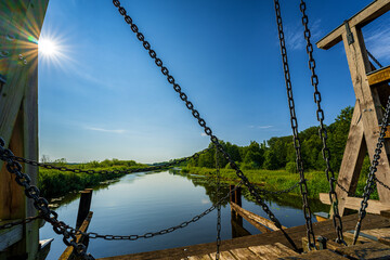 Listed wooden bascule bridge spanning the Trebel near Nehringen, Mecklenburg-Western Pomerania,...