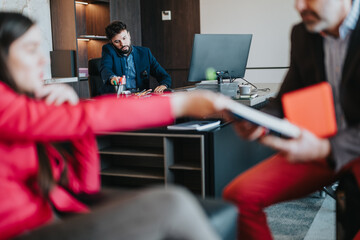 Focused business individuals interacting during a team discussion, highlighting collaboration and...