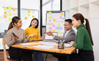 Fototapeta premium Group of business people working together with dashboard analysis and data management in conference room, Corporate business and dashboard to presentation concept.