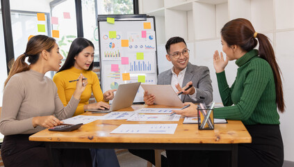 Group of business people working together with dashboard analysis and data management in conference...