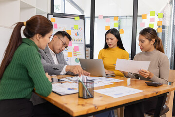 Fototapeta premium Group of business people working together with dashboard analysis and data management in conference room, Corporate business and dashboard to presentation concept.