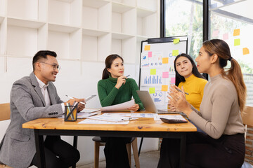 Fototapeta premium Group of business people working together with dashboard analysis and data management in conference room, Corporate business and dashboard to presentation concept.