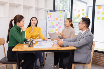 Fototapeta premium Group of business people working together with dashboard analysis and data management in conference room, Corporate business and dashboard to presentation concept.