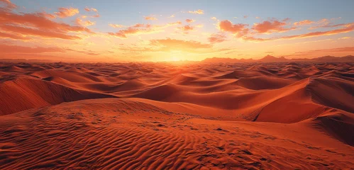 Selbstklebende Fototapeten Desert sunrise sand landscape wide sky cloud orange tranquil nature scene with soft sunlight and textured dunes © visoot