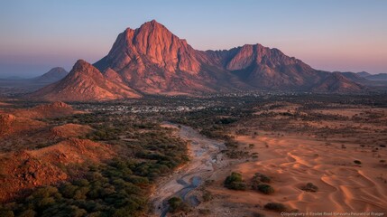 Naklejka premium Dramatic Desert Sunset Landscape Mountains Dunes Oasis