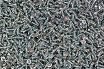 Six-Lobe Torx Flat Undercut Head machine screws many scattered fasteners.