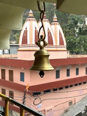 Temple Bell with Hindu Architecture in the Background, Rishikesh, India.
