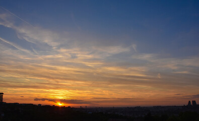 Urban silhouettes under fiery sunset sky. Belgrade evening atmosphere