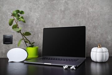 Laptop with office supplies