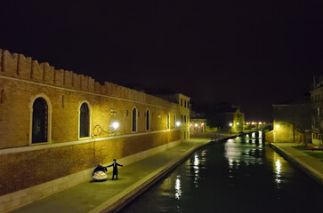 Venice night street scene during annual carnival, Italy