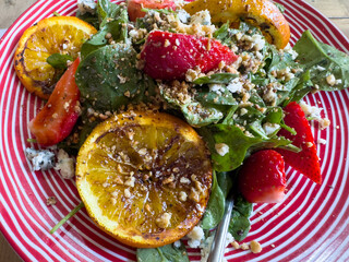 Greek-style spinach salad with grilled oranges and blue cheese