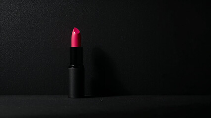 Hot Pink Lipstick on Textured Black Background, Minimalist Beauty Product Photography