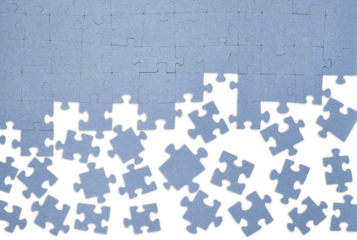 Blue jigsaw puzzle with missing pieces on a transparent background. Incomplete game, concept of problem solving, teamwork, or finding solutions. PNG.